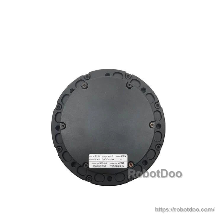 Back face close-up showing round cover with perimeter screws and printed specification label at bottom