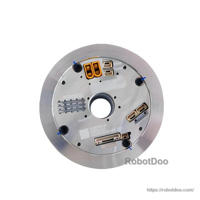 Top plate close-up of robot joint motor showing multiple connectors, screw points, and center hollow shaft opening