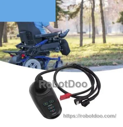 Joystick controller with red and black connectors beside an electric wheelchair