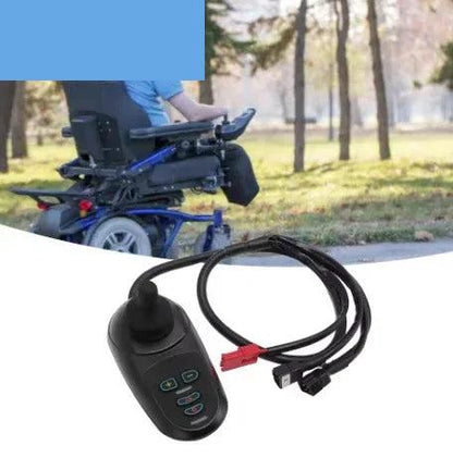 Electric wheelchair joystick controller and cable shown with a powered wheelchair outdoors