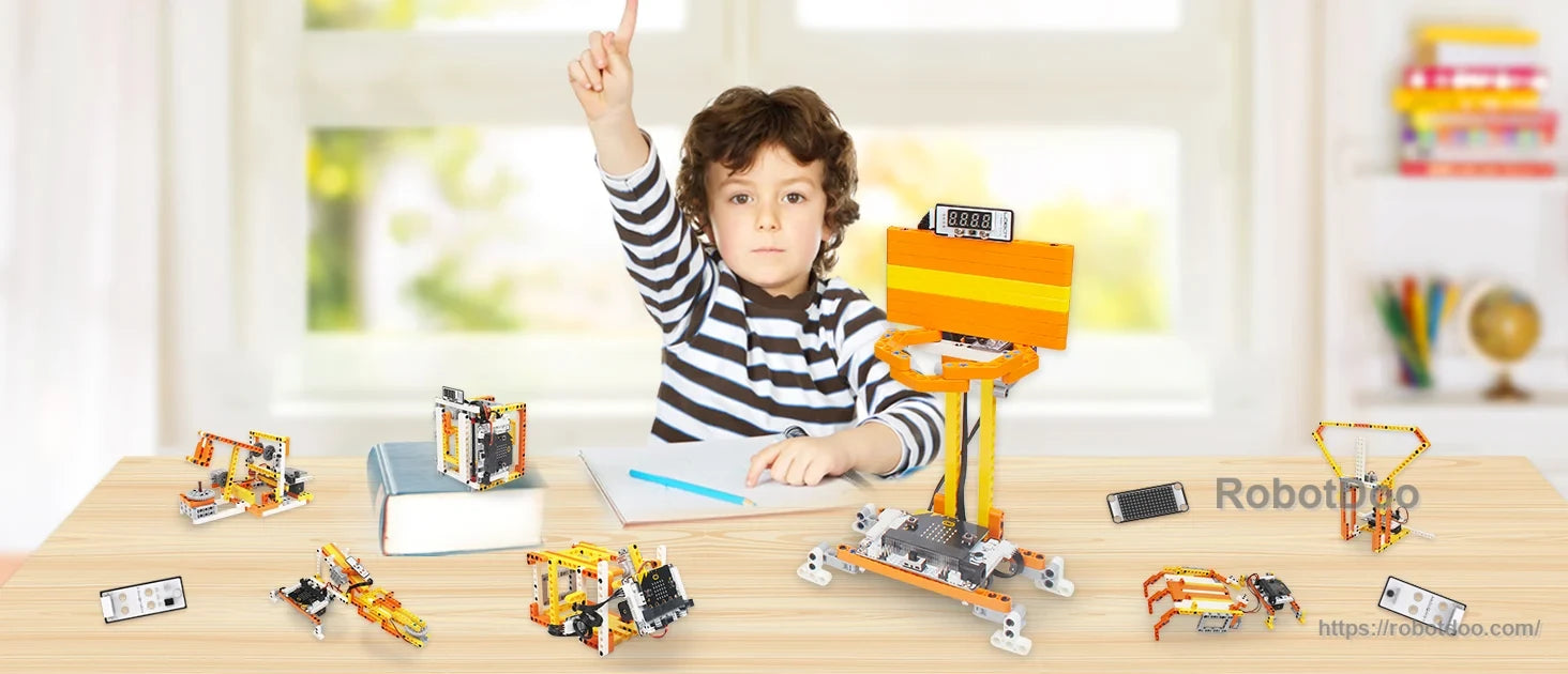 Child building and programming DaDa:bit STEM robotics models with modular electronic blocks