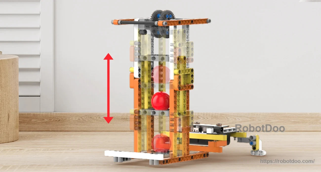 Vertical ball elevator model lifting red balls through a transparent tower