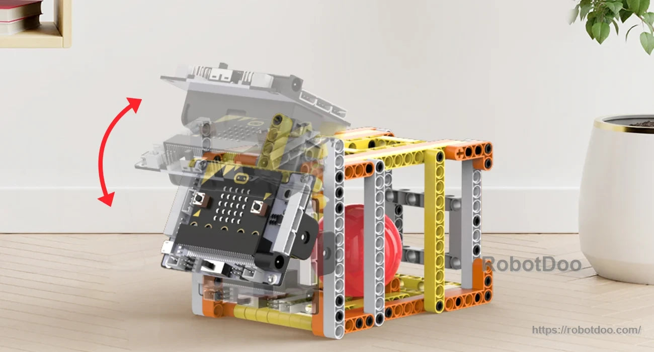 Micro:bit-equipped rolling block model with a hinged front panel in motion