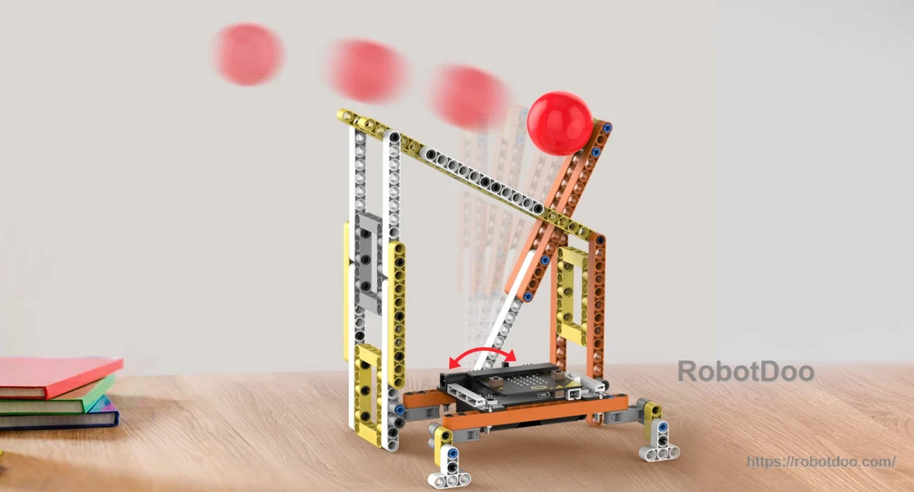 Motorized ball-launching build with an adjustable arm and red ball motion path