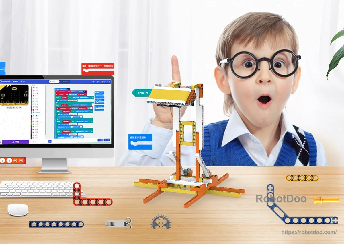 Child using DaDa:bit micro:bit building blocks kit beside a computer with graphical block programming controls