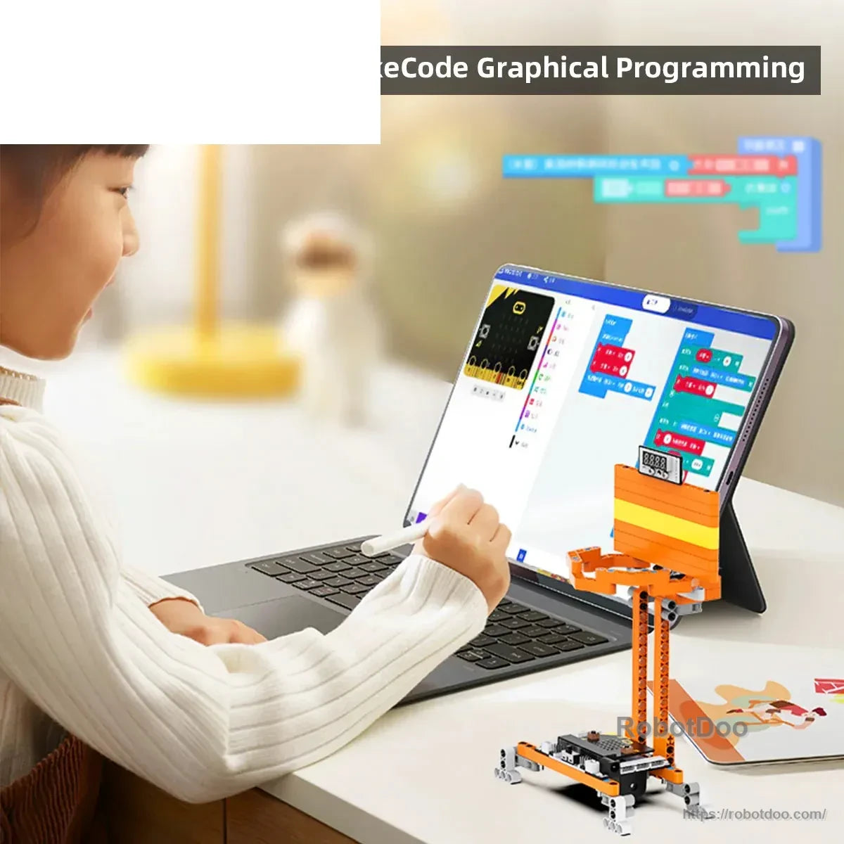 Child using graphical block programming on a tablet with a DaDa:bit basketball shooting robot