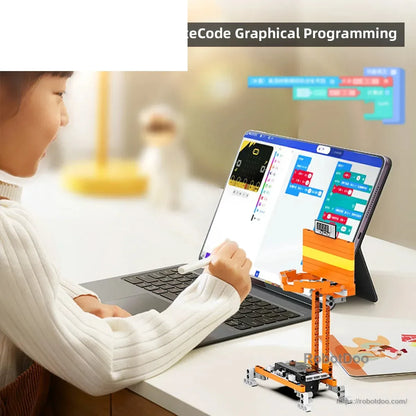 Child using graphical block programming on a tablet with a DaDa:bit basketball shooting robot