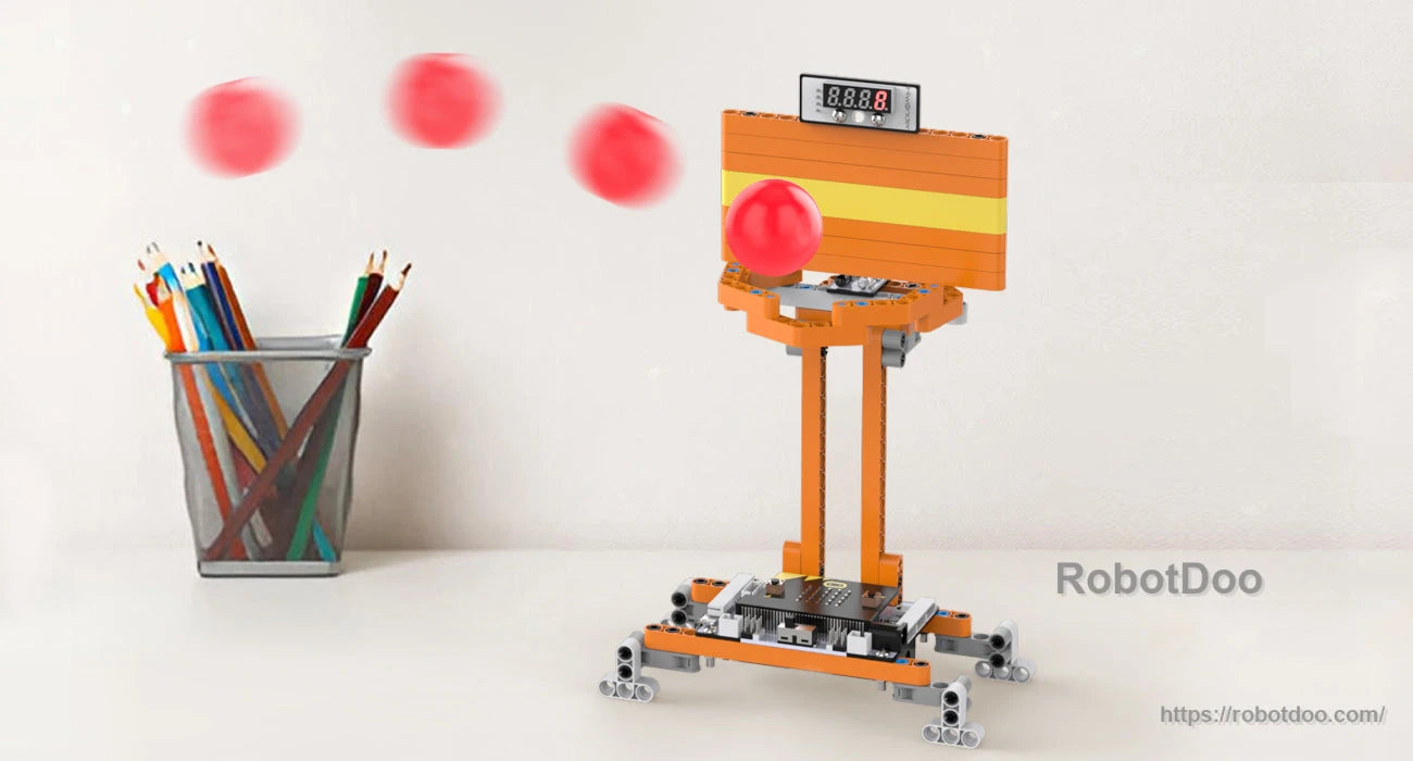 DaDa:bit micro:bit DIY building blocks kit assembled as a ball launcher with digital display and orange frame