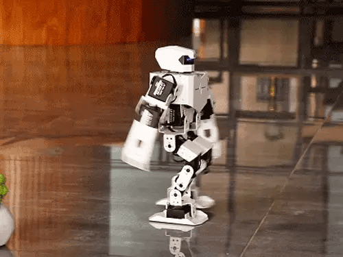 H5S humanoid robot walking across a reflective indoor floor