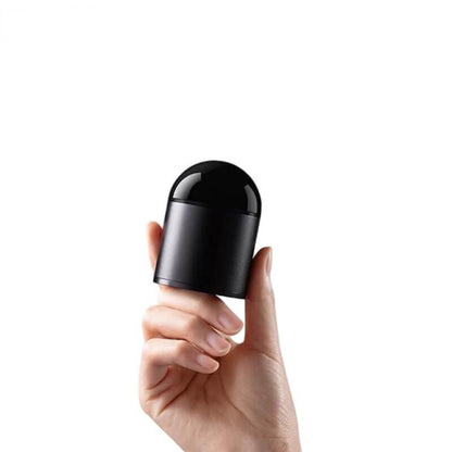 Handheld view of compact rotating LiDAR sensor showing size relative to fingers