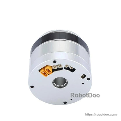 Rear view with connector positions visible around center bore, including orange plug and recessed ports