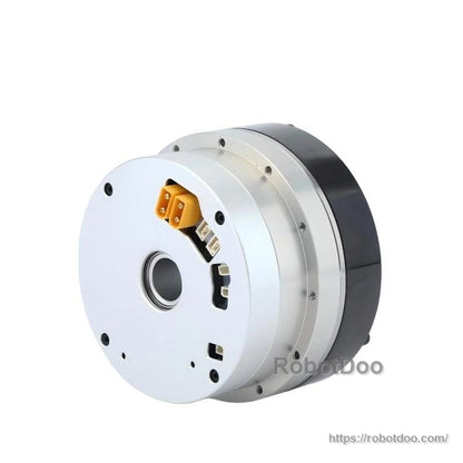 Connector-side angled view showing orange power plug and port openings on the motor module face
