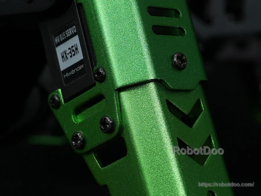 Close-up of the Hiwonder JetHexa hexapod robot’s green metal leg joint with HX-35H servo