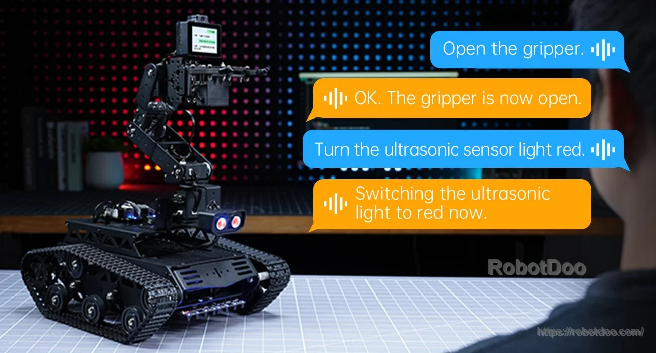 Tankbot responding to voice commands for gripper control and ultrasonic sensor lighting