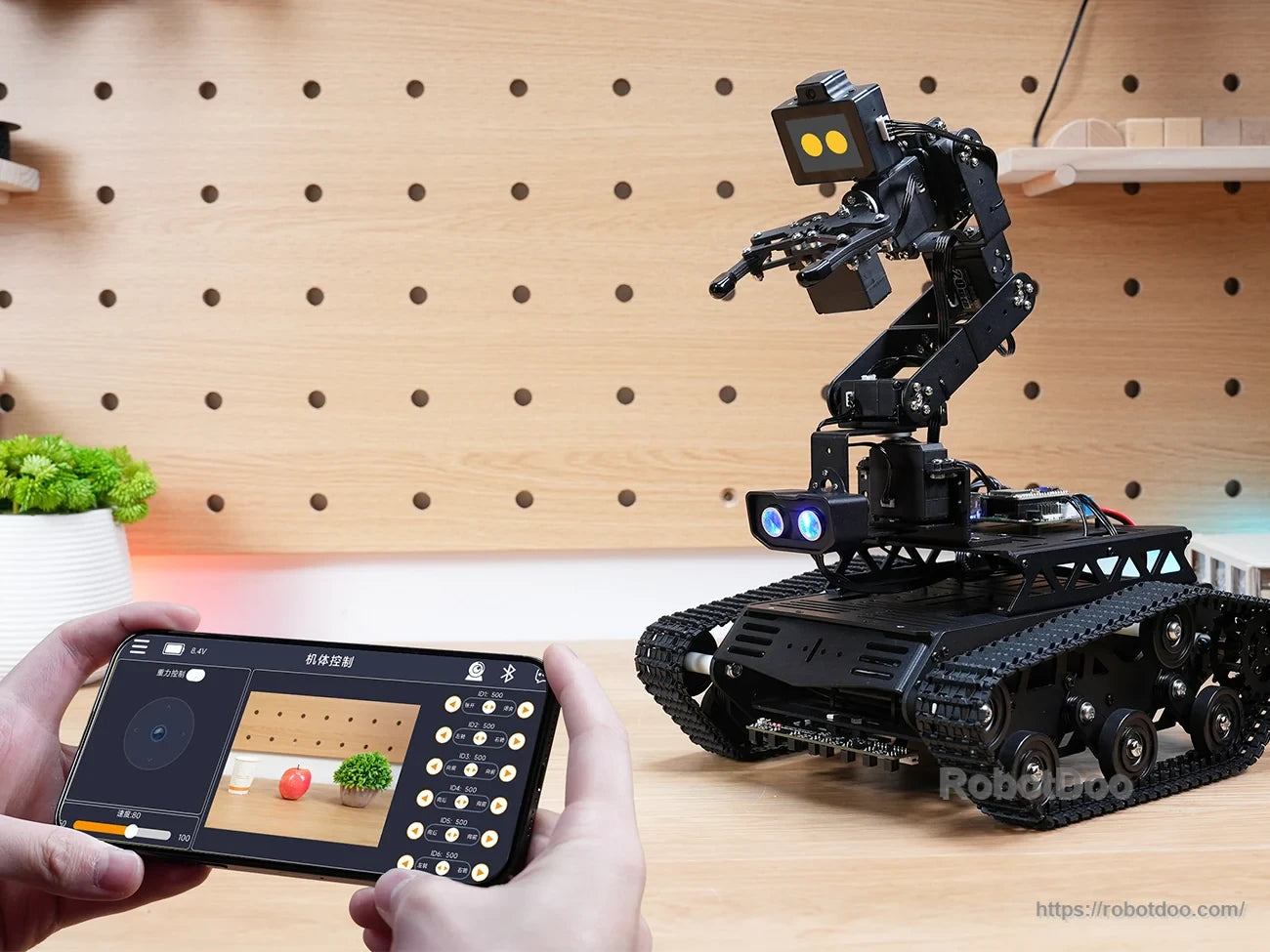 Hiwonder Tankbot ESP32-S3 AI tracked robot with robotic arm, LED eyes, and smartphone control interface
