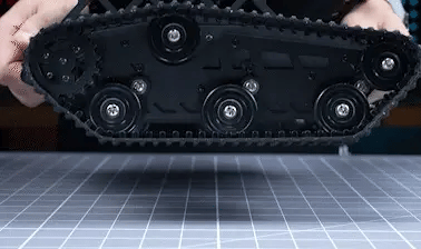Underside of the Tankbot tracked chassis demonstrating torsion-spring suspension travel