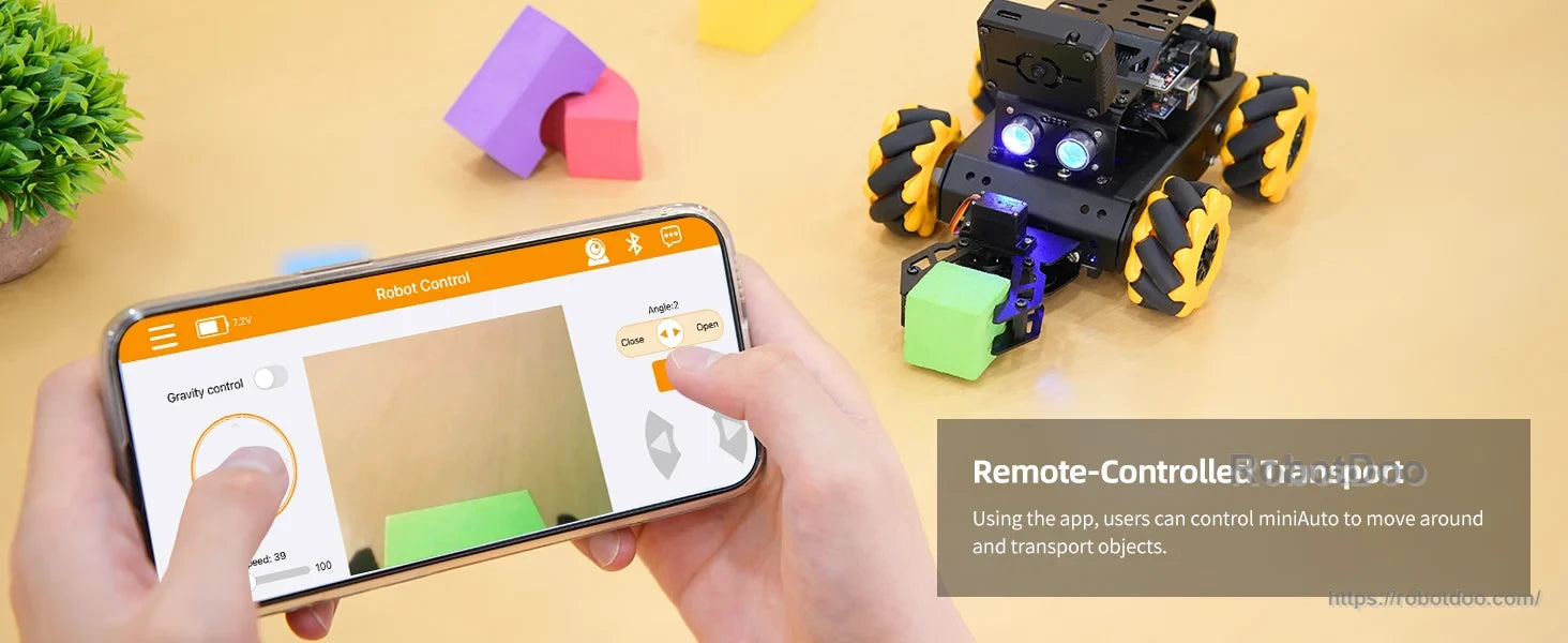 miniAuto robot remotely controlled by smartphone while carrying a small block