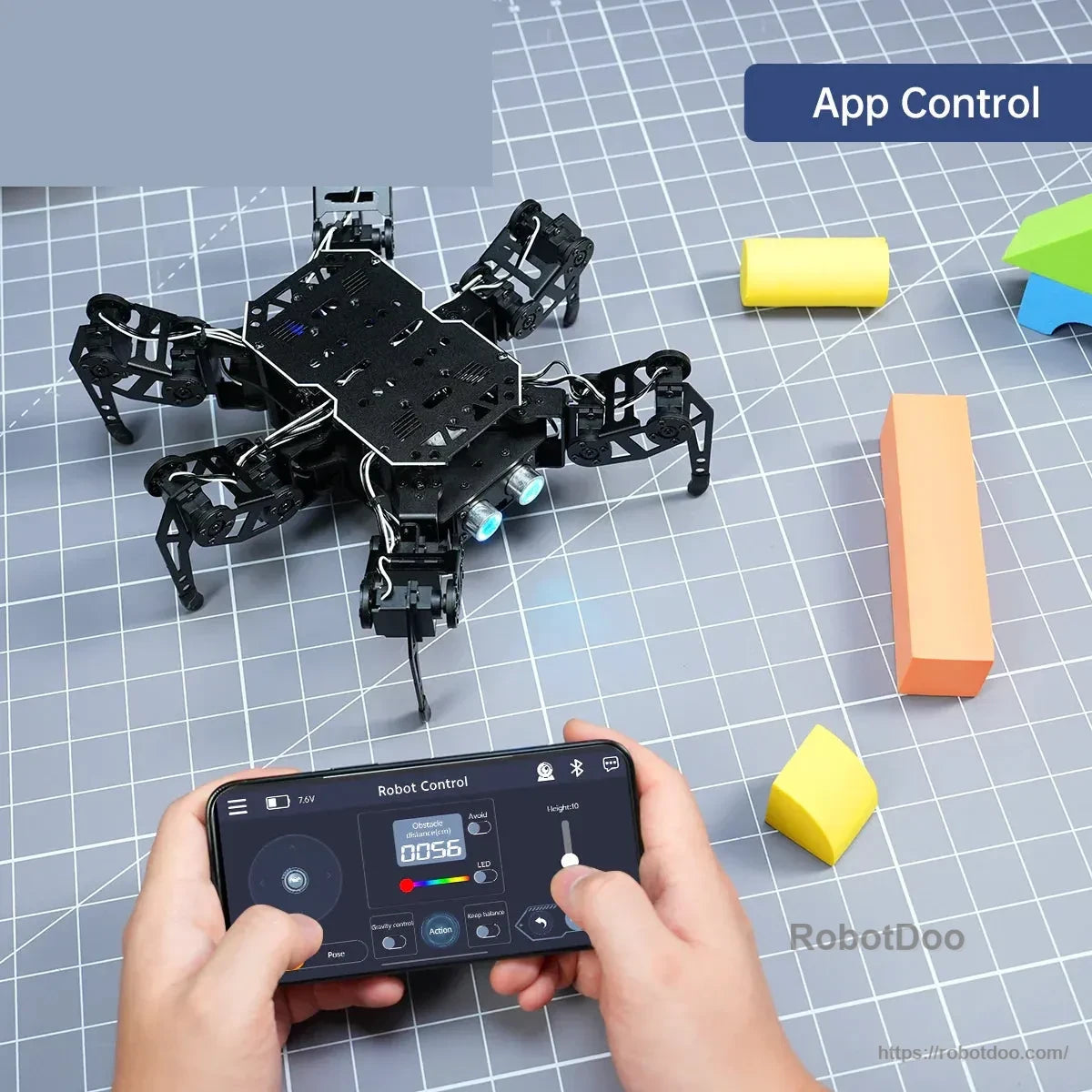 Hexapod robot controlled from a smartphone app on a tabletop obstacle course