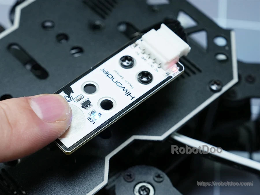 Hiwonder miniHexa hexapod robot control board with two push buttons and a white connector