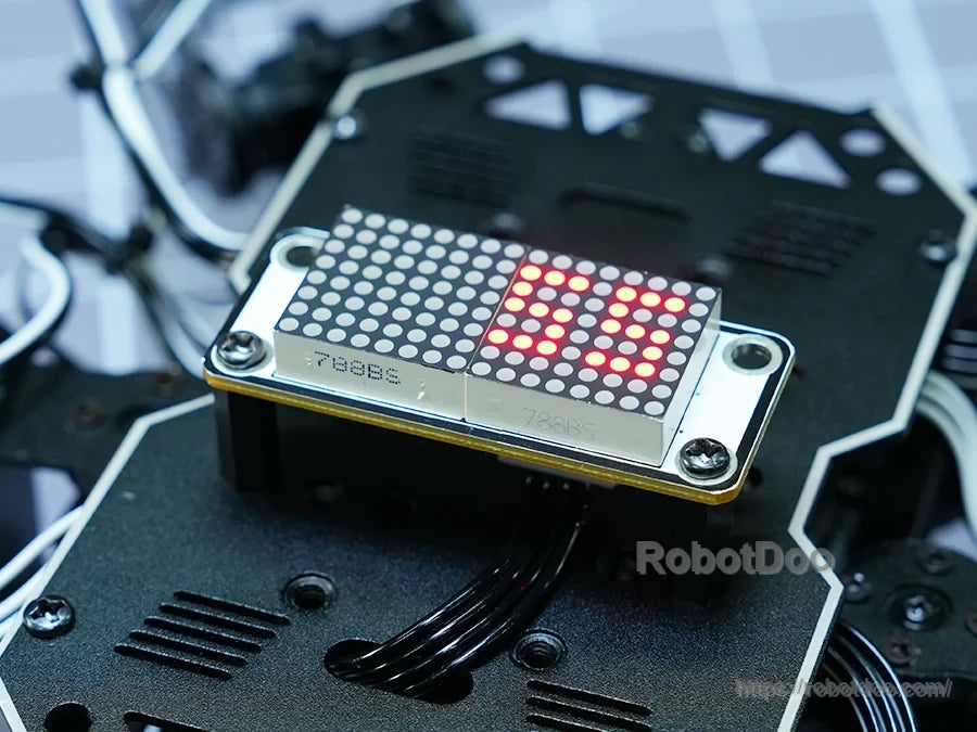 Hiwonder miniHexa 18DOF hexapod robot with dual LED dot-matrix display showing animated red eyes