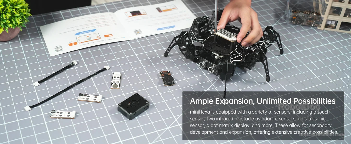 Hiwonder miniHexa 18DOF AI hexapod robot with black leg assembly, control board, cables, and expansion modules