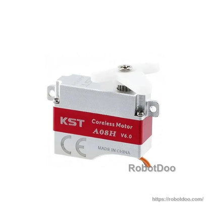 KST A08H coreless micro servo with white horn attached, showing mounting tabs and case screws
