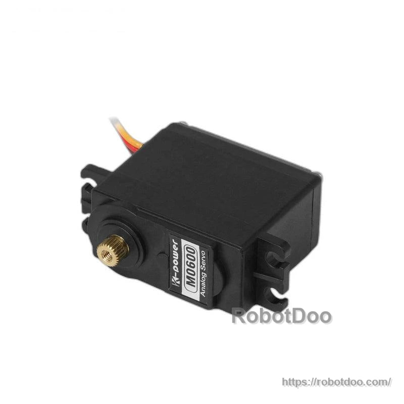 Black analog servo motor close-up showing mounting tabs, lead wire, and brass output gear