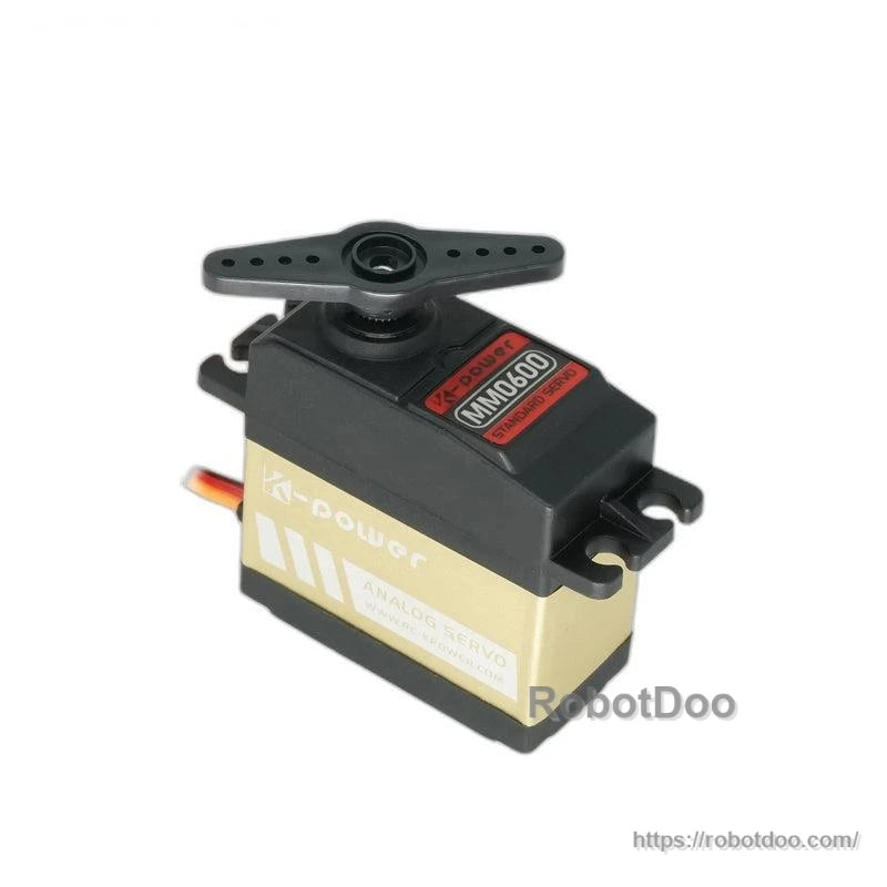 Kpower MM0600 servo motor with attached servo horn arm, showing output shaft and housing