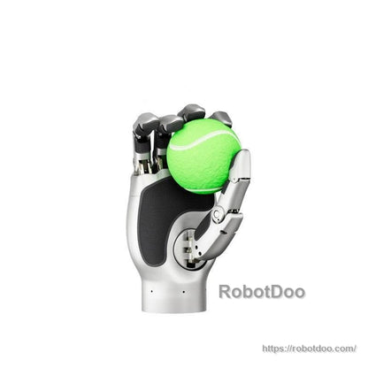 Robotic hand holding a green tennis ball, demonstrating precision grip on round objects