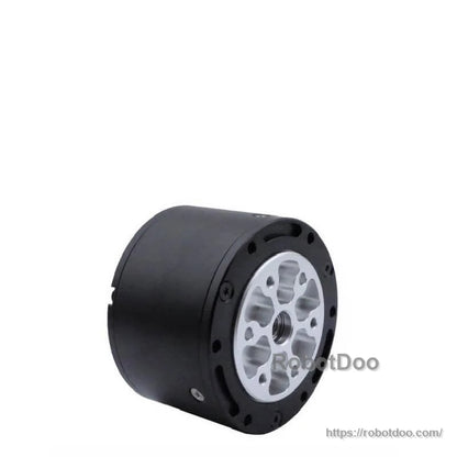 Angled view of gearbox output flange with metal faceplate and black motor housing