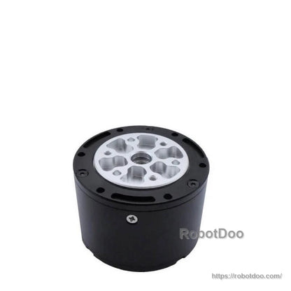 Output side of motor showing silver planetary gearbox mounting face and central shaft bore