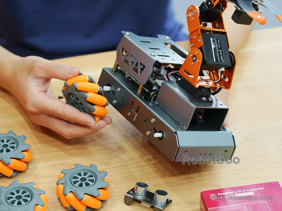 MasterPi kit assembly view with Mecanum wheels, ultrasonic sensor, and metal chassis