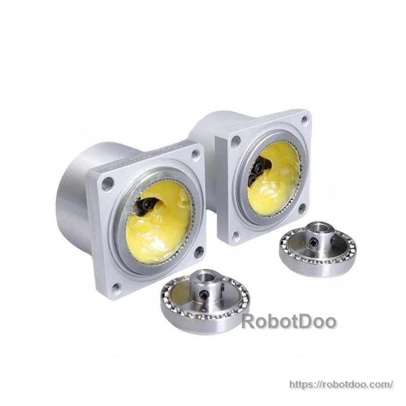Disassembled view: reducer housings with yellow grease inside and separate bearing/output components