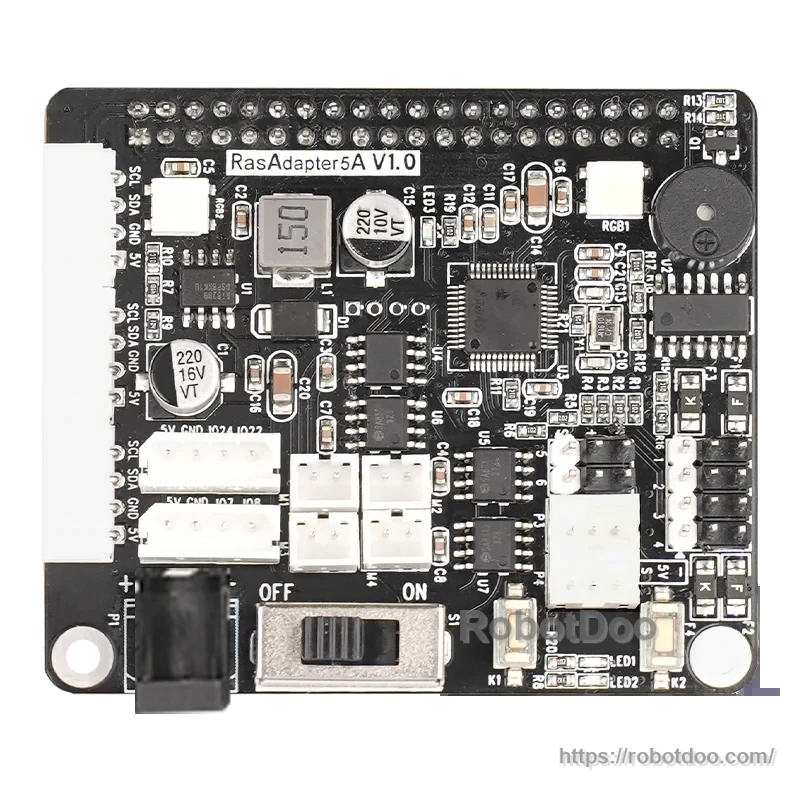 Close-up of RasAdapter5A V1.0 board showing DC barrel jack input, power switch, buzzer, and multiple servo/motor headers
