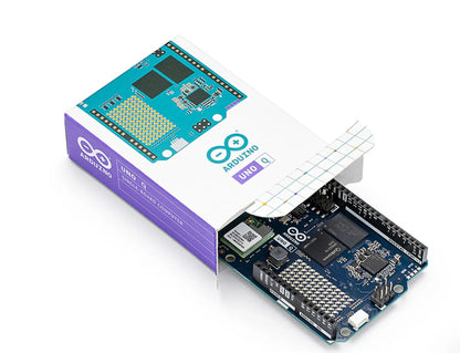 Arduino UNO Q board partially removed from its retail box, showing front packaging artwork