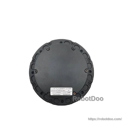 Back face close-up showing round cover with perimeter screws and printed specification label at bottom