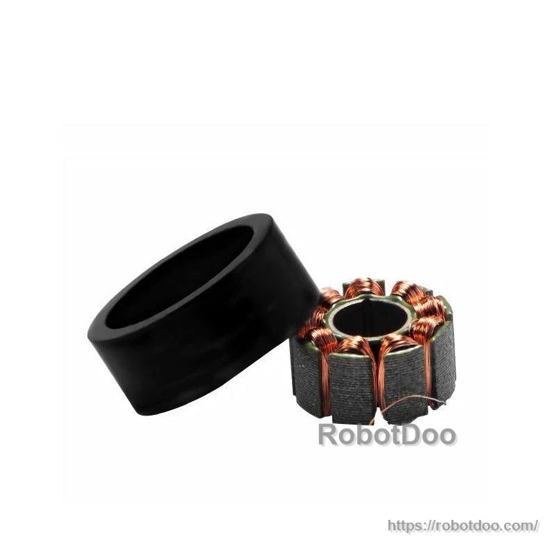 Motor parts set showing black outer ring housing next to copper-wound stator core