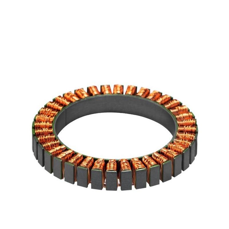 Motor stator with copper windings and segmented outer teeth, angled view